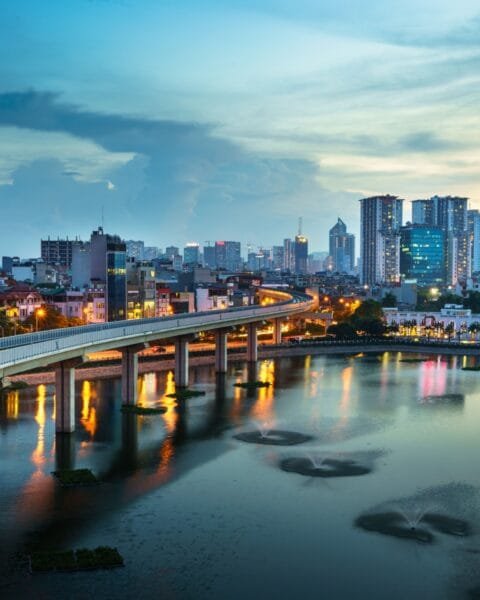 Vietnam Smart City Projects: Aerial skyline view of Hanoi. Hanoi cityscape at twilight at Hoang Cau lake.